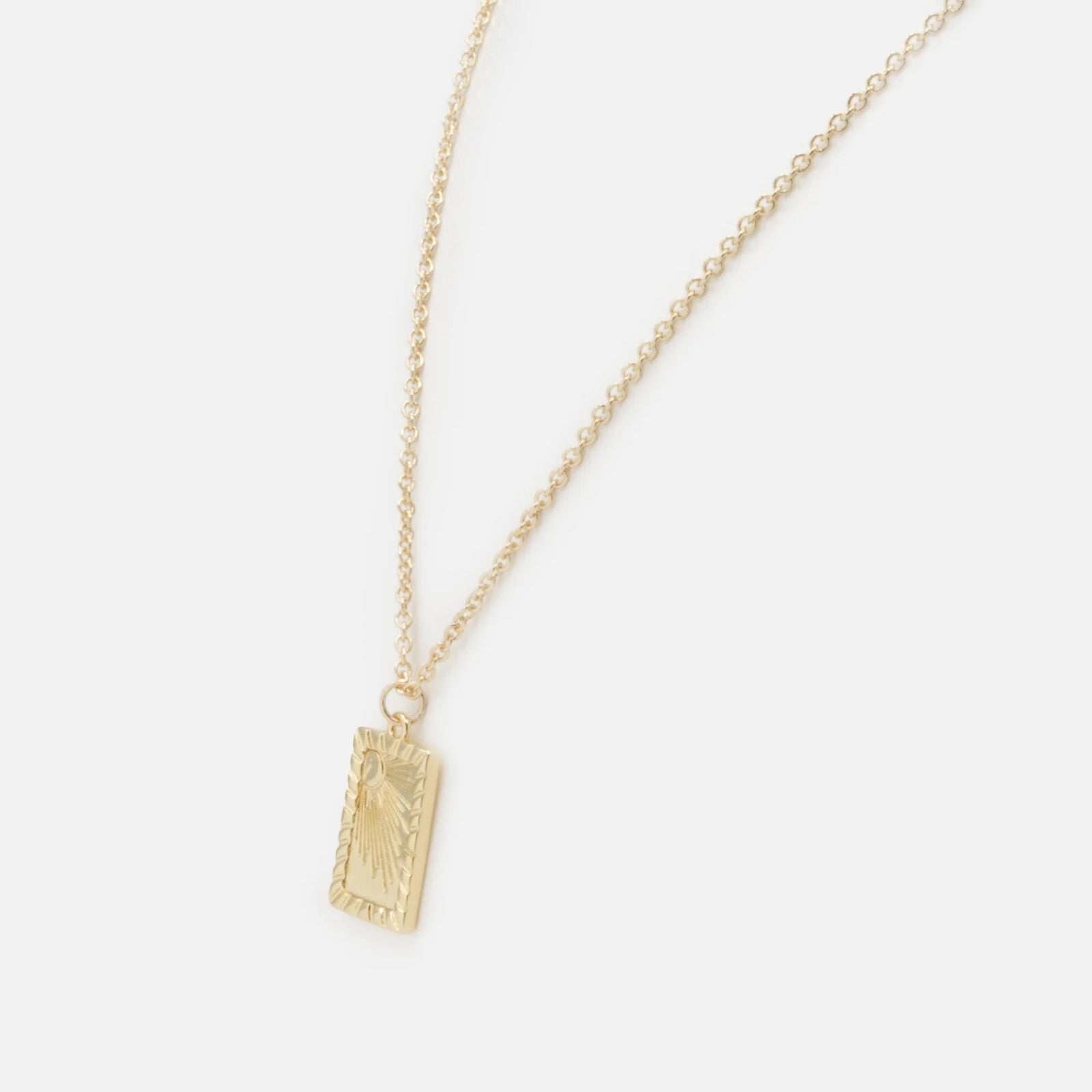 Golden Sun Necklace with a rectangular sun-engraved pendant on a delicate gold chain.