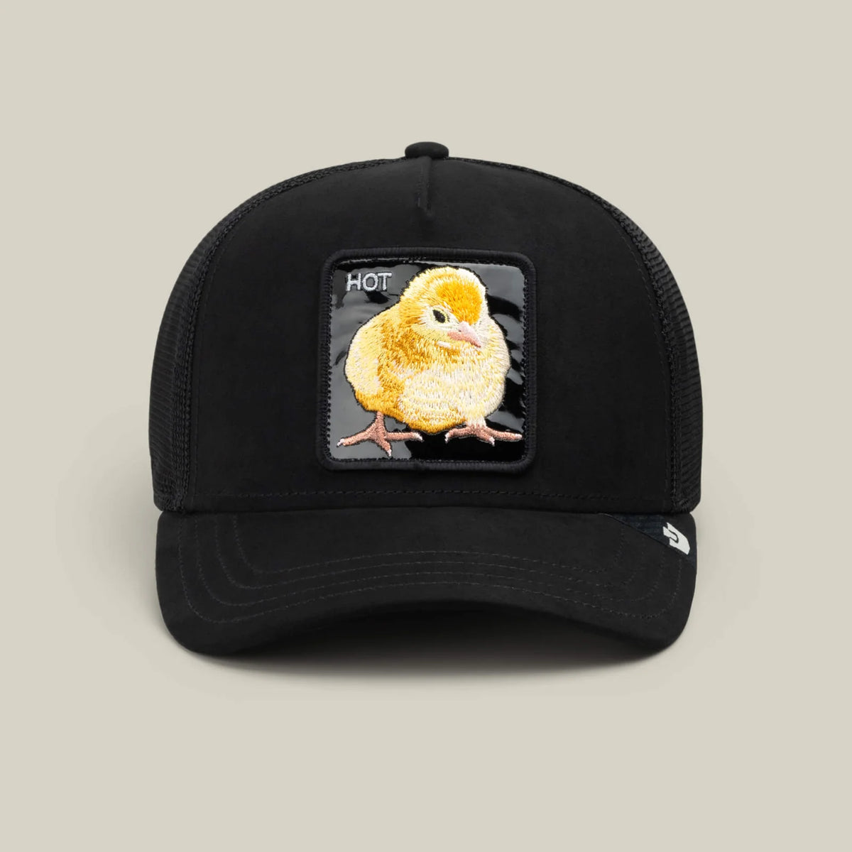 Black trucker hat featuring embroidered yellow chick patch with HOT text, part of The Animal Farm series.