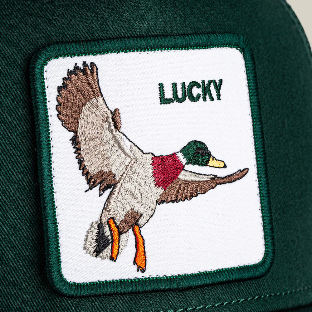 Goorin Lucky Duck Trucker Hat with iconic duck patch on green fabric.