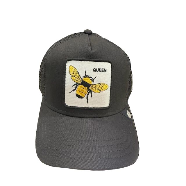 Goorin Queen Trucker Hat black trucker cap with yellow bee patch on front, bold crown style.