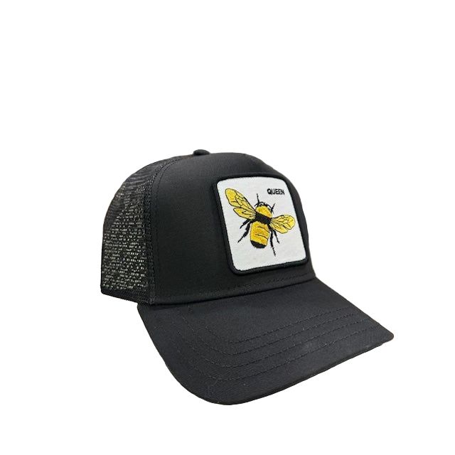 Goorin Queen Trucker Hat by Goorin Bros — black trucker hat with yellow bee patch on white square.