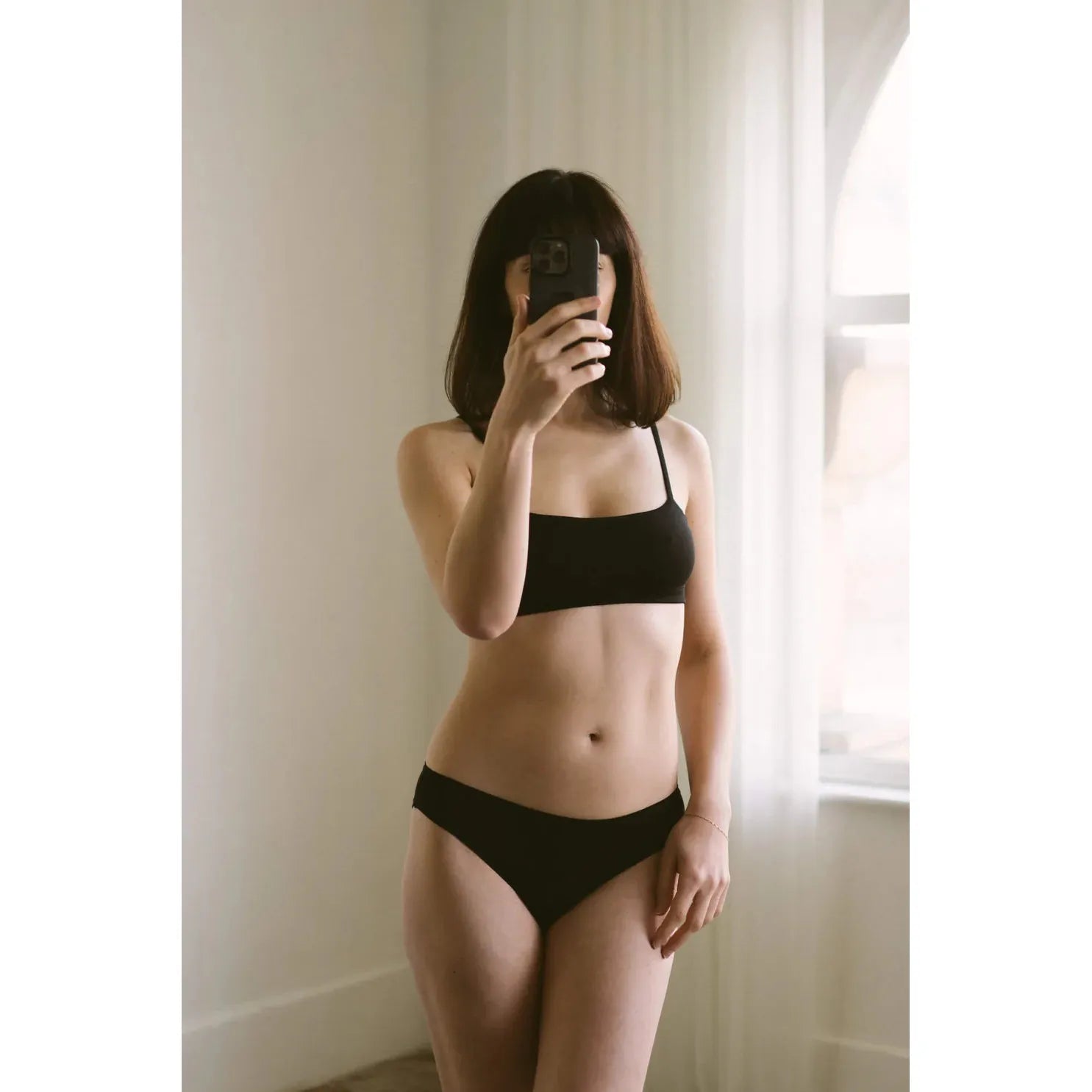HuHa Bikini Mineral Undies in black, crafted from sustainable TENCEL™ fibers for lasting freshness and comfort.