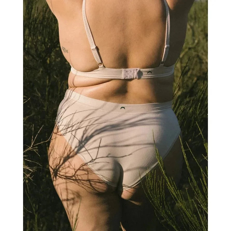 HuHa Cheeky Mineral Undies back view on model in nude-toned underwear outdoors