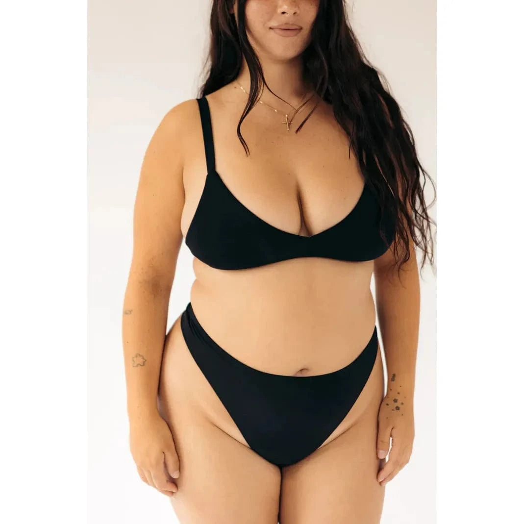 HuHa Seamless High Rise Thong on a model in black underwear.