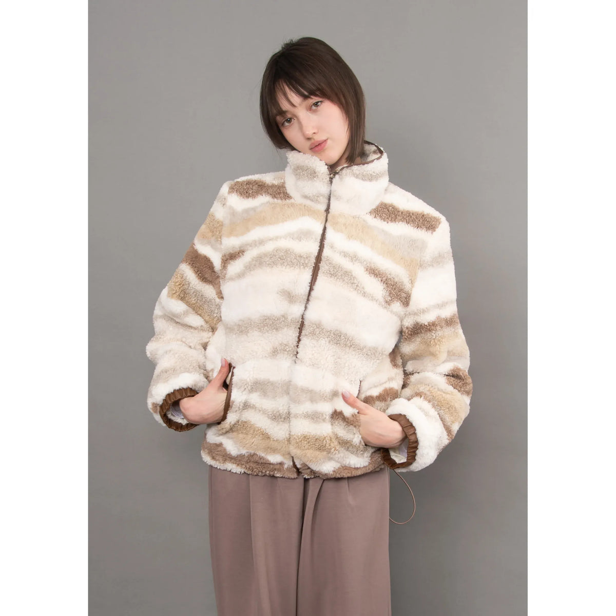 Striped plush sherpa zip jacket with brown velvet trim details, featuring a cozy high collar and casual fit.