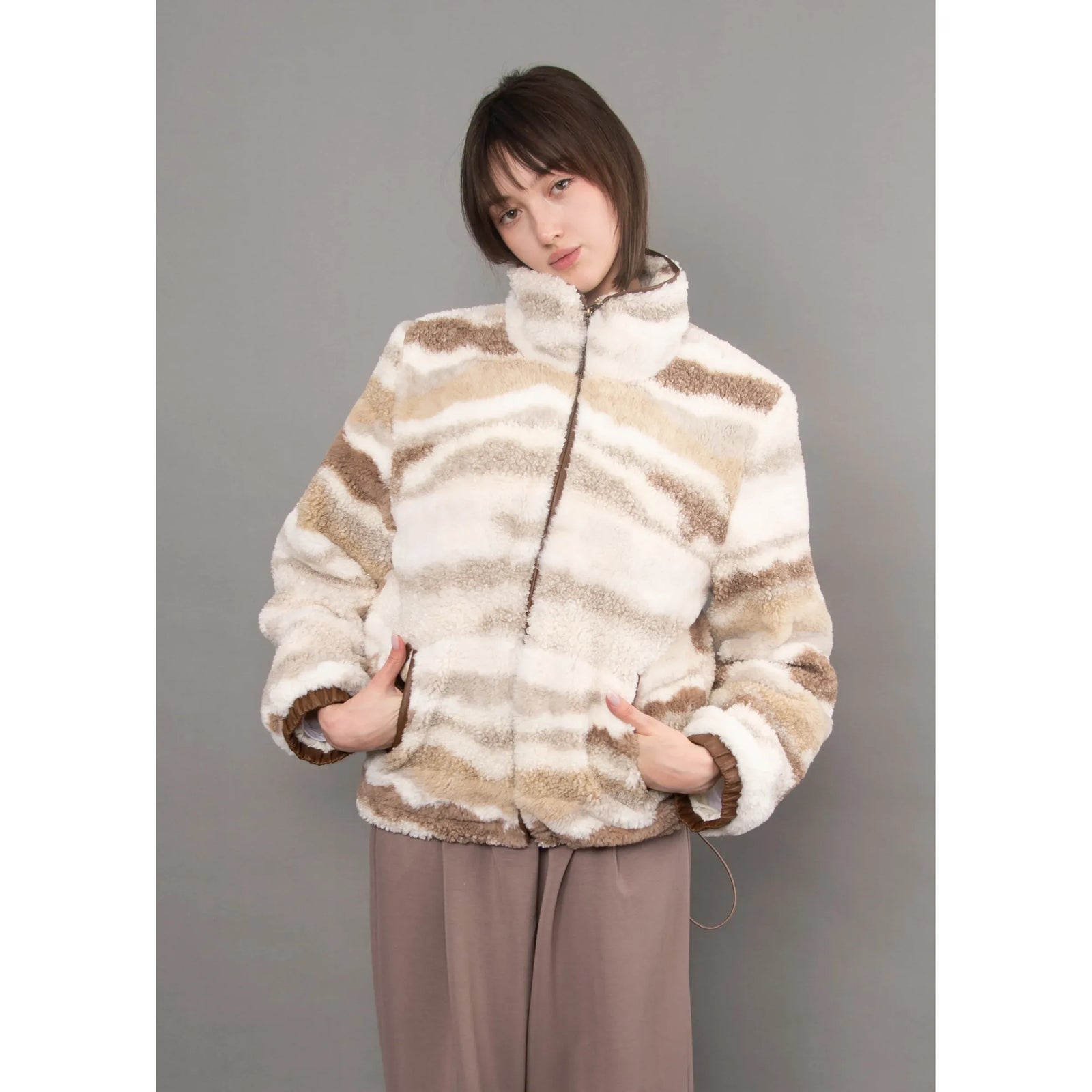 Striped plush sherpa zip jacket with brown velvet trim details, featuring a cozy high collar and casual fit.