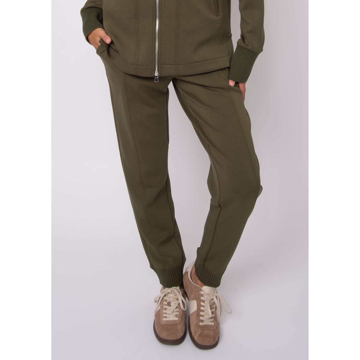 Model wearing olive Joselle soft knit pull-on joggers with adjustable drawstring waist and ribbed cuffs.