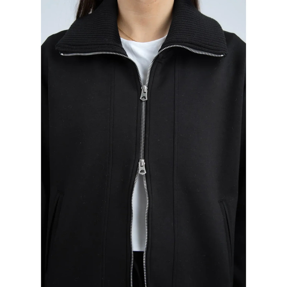 Black Judia Soft Knit Zip Sweater with oversized silhouette, two-way zipper, and ribbed collar and cuffs.