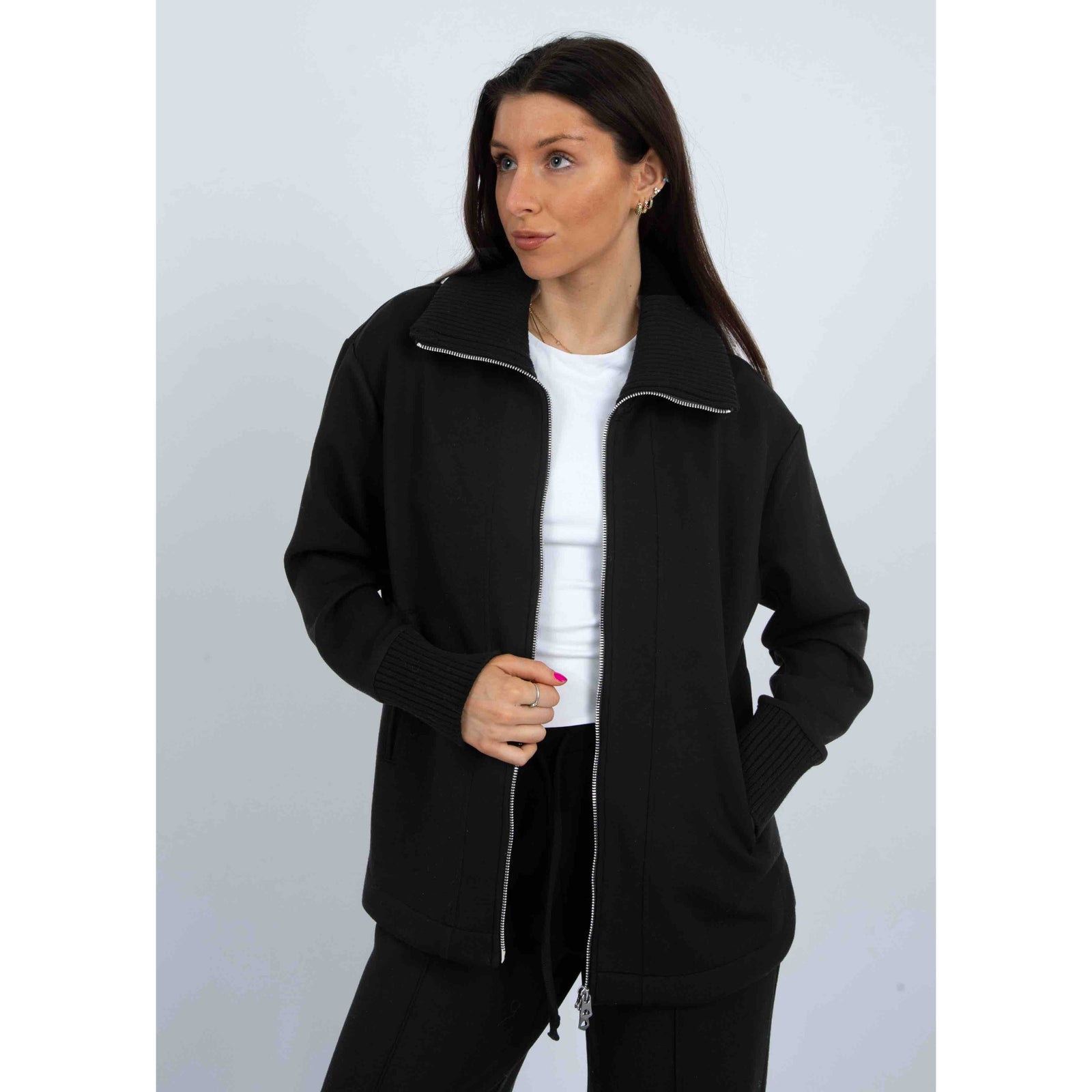 Judia Soft Knit Zip Sweater in black, oversized jacket with two-way zipper and ribbed collar and cuffs, on model.