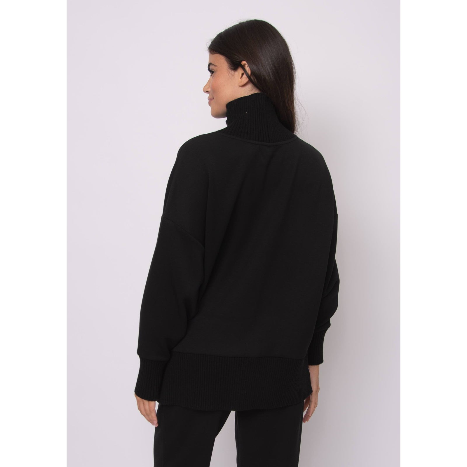 Katelyn Soft Knit Sweater in black, oversized modal knit with ribbed cowl neck, relaxed silhouette, side zipper detail.
