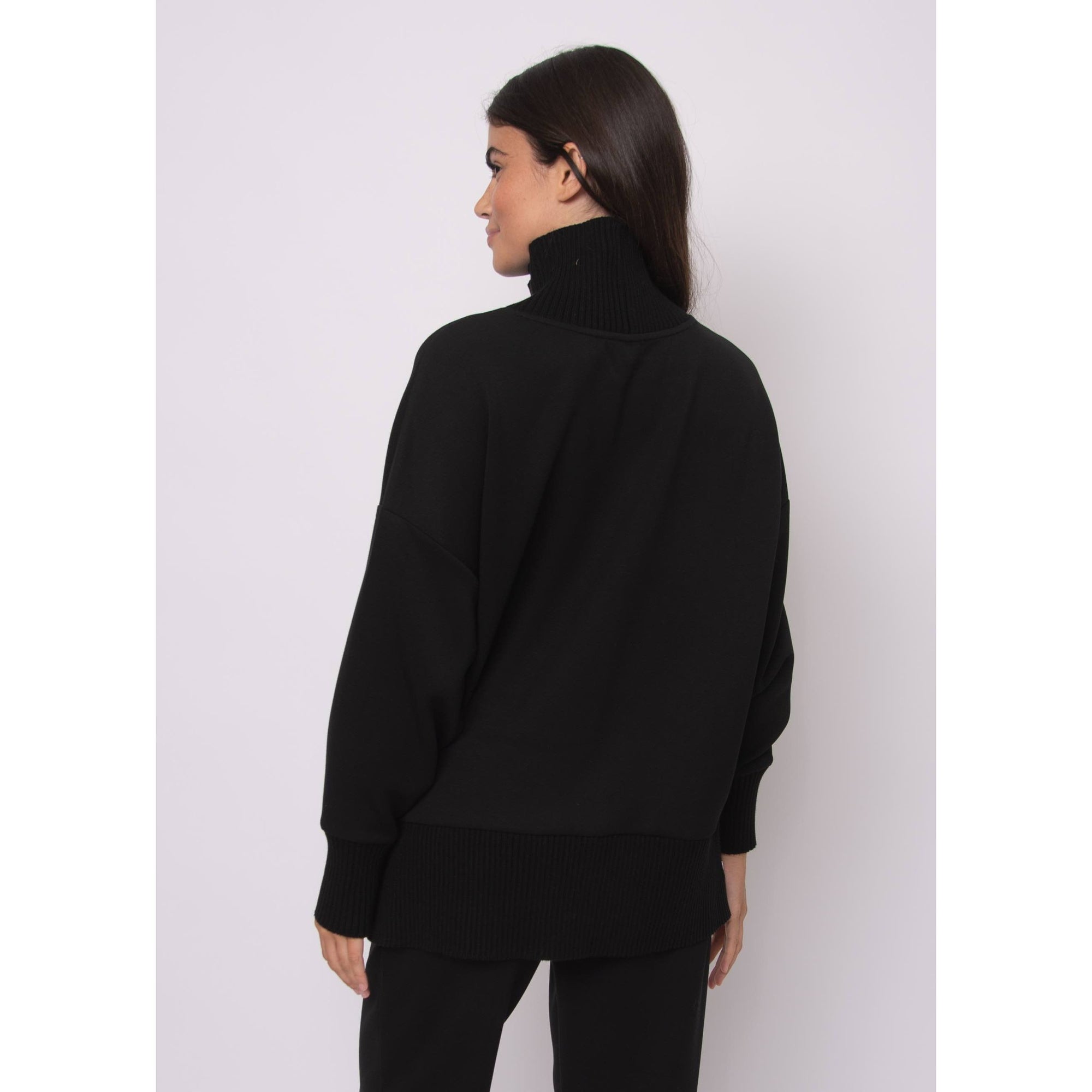 Katelyn Soft Knit Sweater in black, oversized modal knit with ribbed cowl neck, relaxed silhouette, side zipper detail.