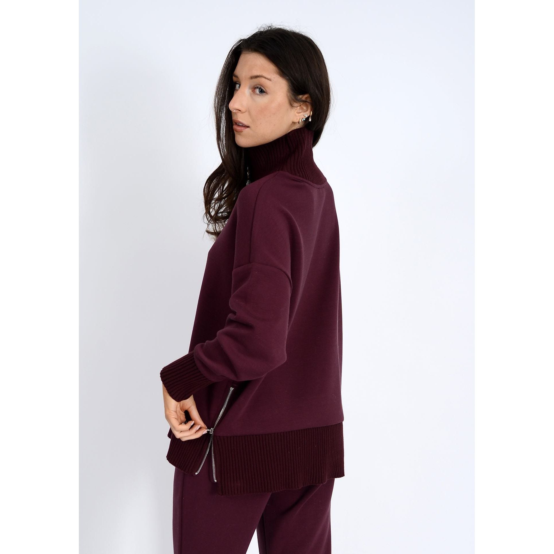 Katelyn Soft Knit Sweater in burgundy with ribbed neck, oversized relaxed fit, side zip detail and ribbed hem.