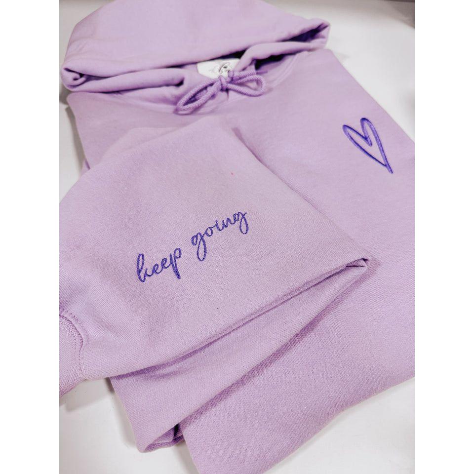 Keep Going Embroidered Hoodie in soft lavender with heart and motivational script for stylish inspiration.