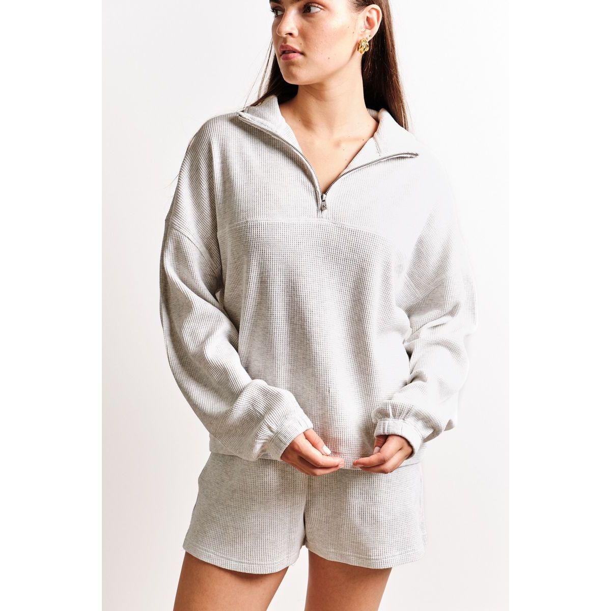 Kuwalla Bailey Waffle Zip Up: cozy light gray waffle-knit long-sleeve pullover with half-zip for layering.