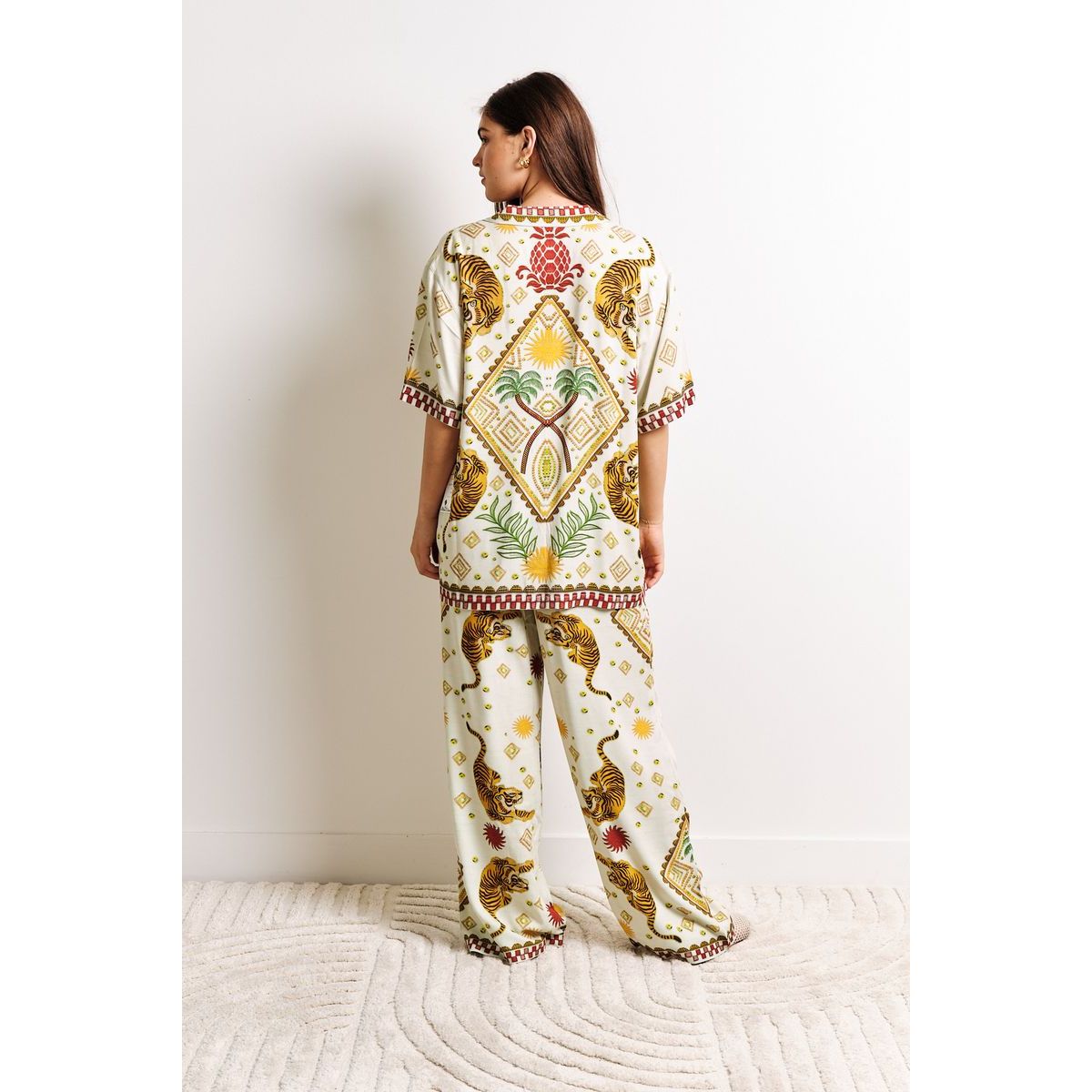 Model wearing Kuwalla Beach Shirt Tiger Cream - relaxed tiger-print cream beach shirt for coastal style.