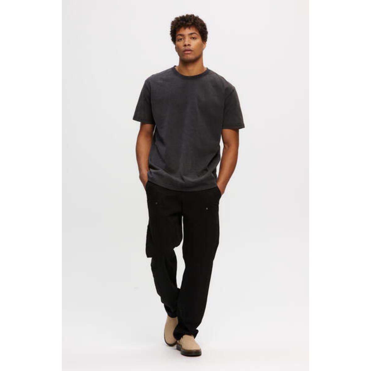 Kuwalla Heavyweight Boss Tee worn by model; vintage-wash, oversized 100% cotton tee.