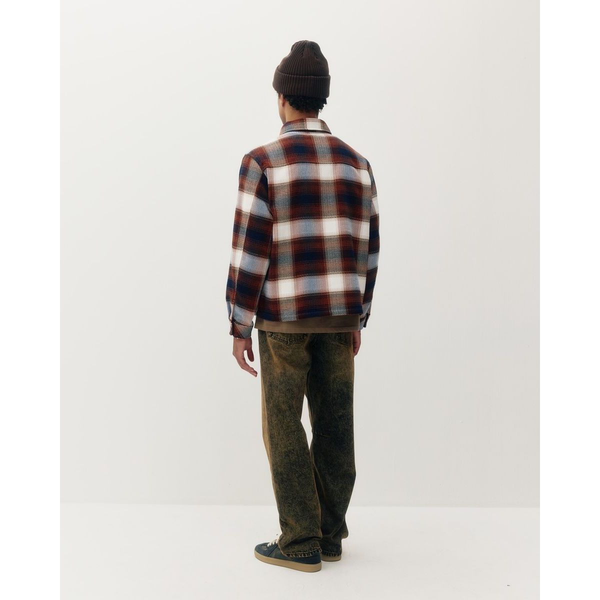 Back view of a heavyweight plaid shacket in red, navy, and white. Versatile shirt-jacket hybrid for cool weather layering.