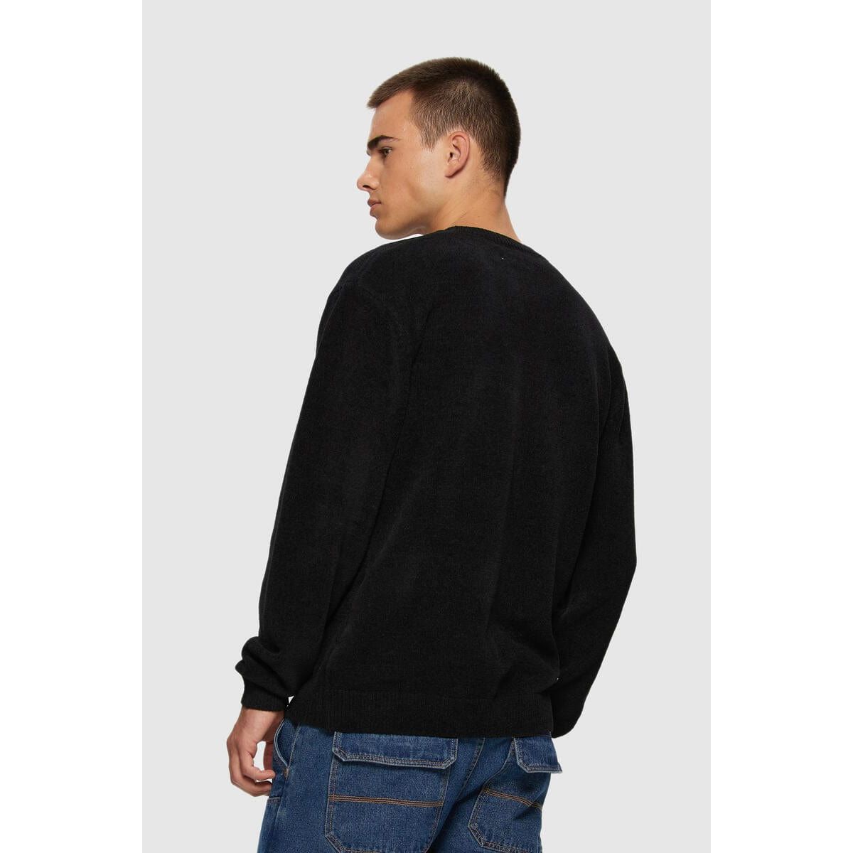 Kuwalla Textured Knit Crew on a model in a black rib knit sweater — back view, Kuwalla.