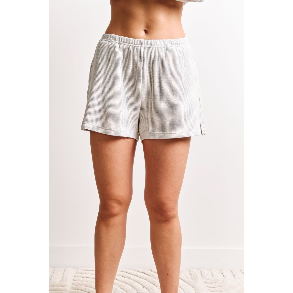 Kuwalla Tyla Waffle Shorts in light gray with a matching relaxed-knit zip-up for casual athleisure.