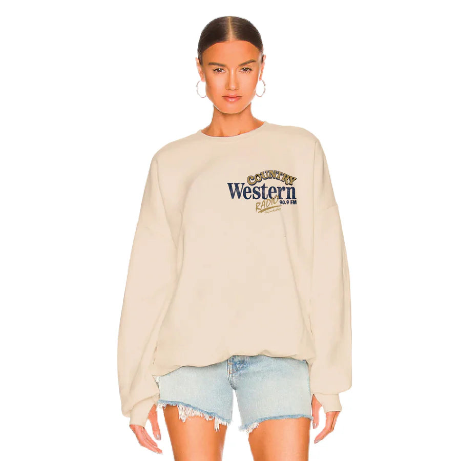 Woman wearing a beige sweatshirt with 'Country Western' text on a white background