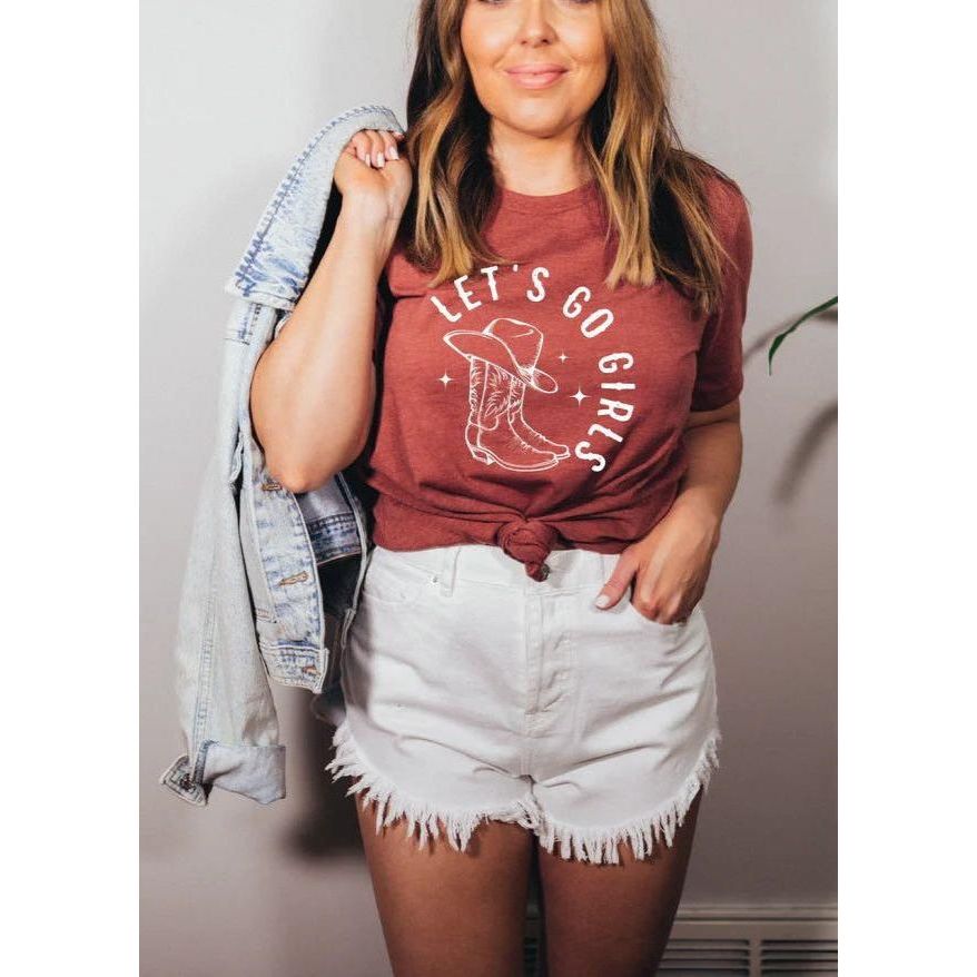 A woman in a relaxed tee showcasing "Let's Go Girls," perfect for a fun-loving, carefree vibe.