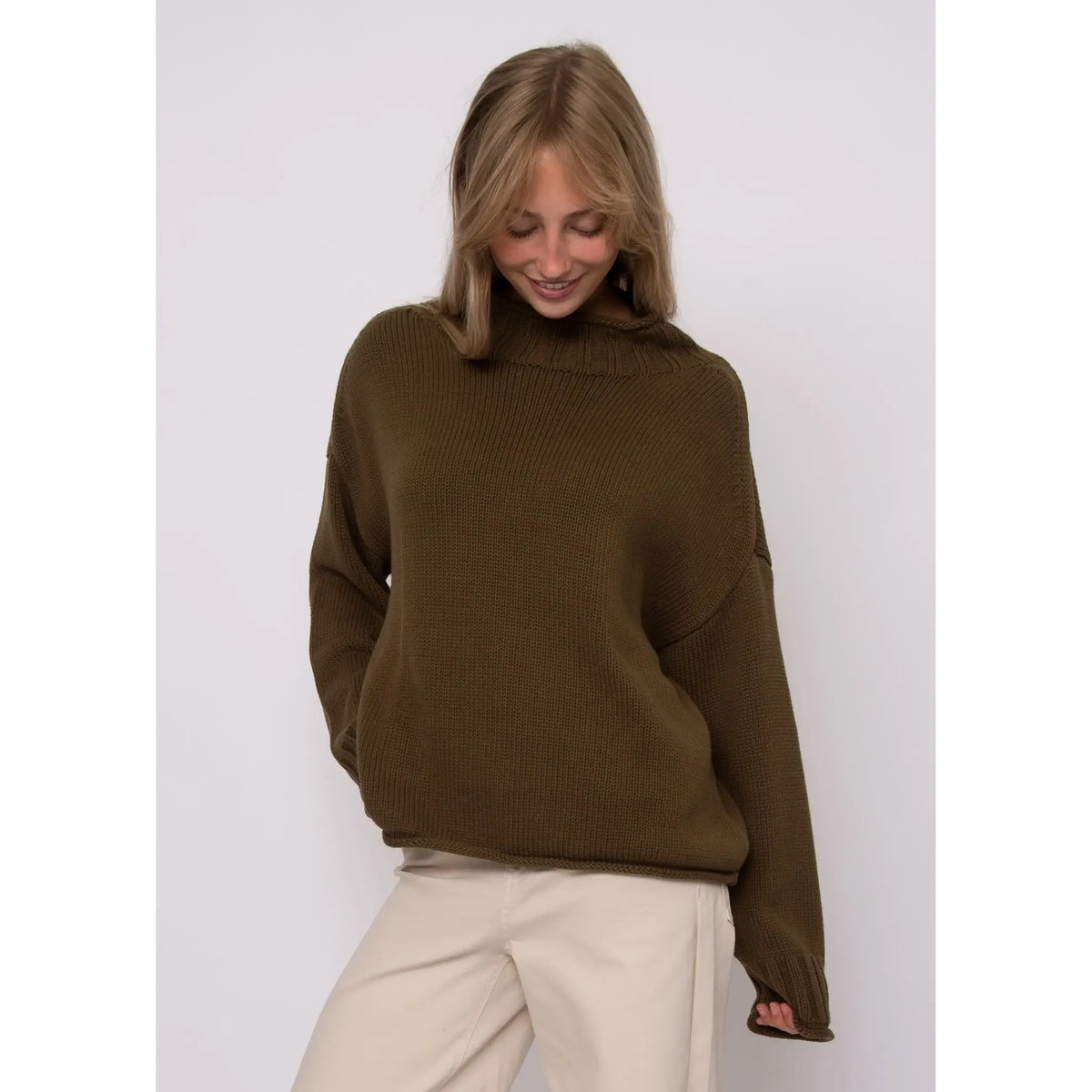 Olive green Lucretia funnel neck sweater featuring a stand-up collar, long sleeves, and ribbed texture for cozy cold-weather style.