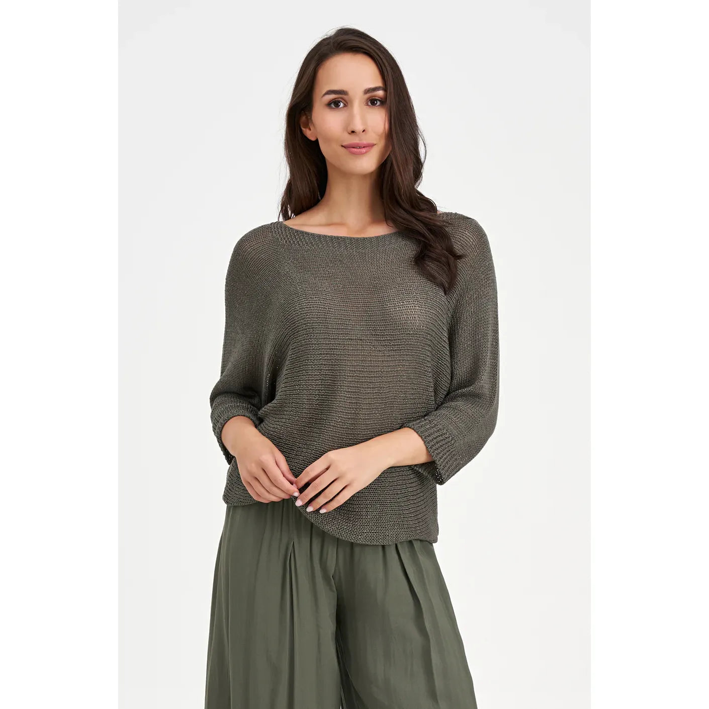 Model wearing textured gray M Made in Italy Pullover Sweater with loose fit, paired with olive wide-leg pants.