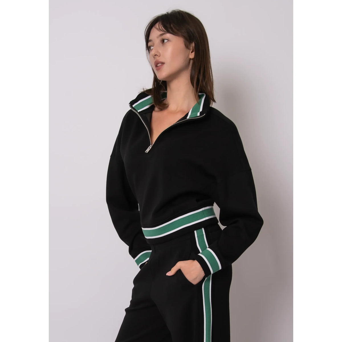 Mailyn Soft Knit Half Zip Pullover in black with green/white striped collar, cuffs, and hem.