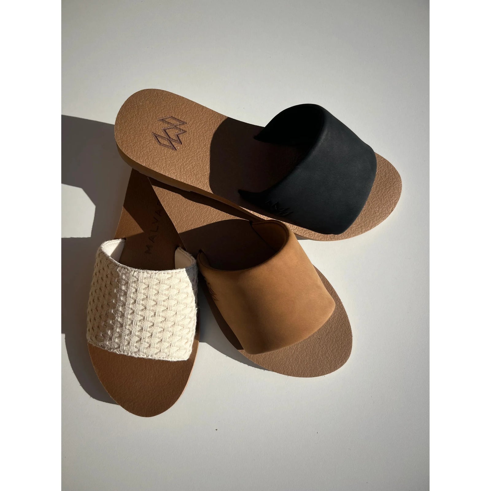 Discover comfort with Malvados Ellie II sandals in versatile styles, featuring memory foam and high arch support.