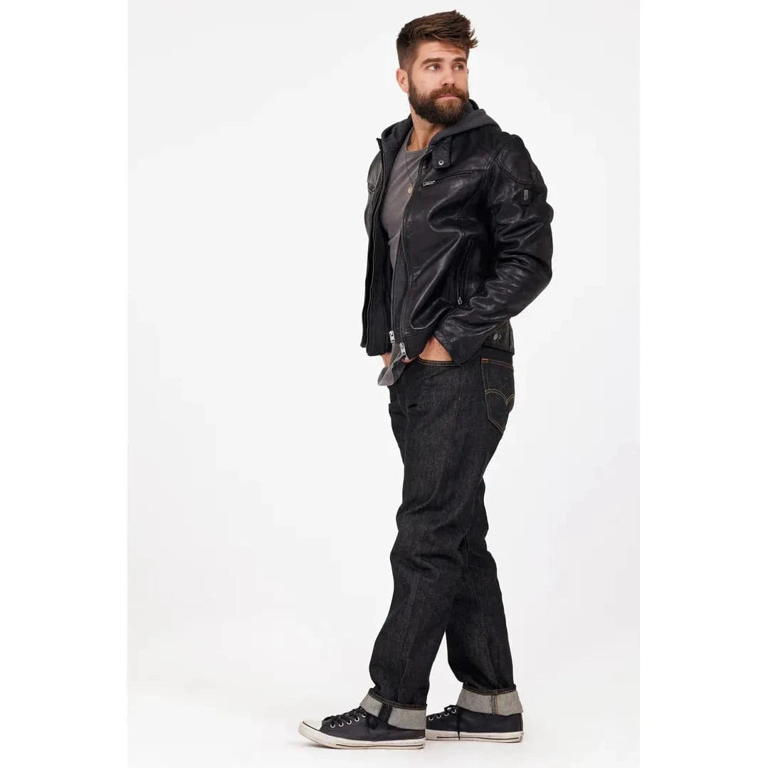 Mauritius Biko UF Jacket on a man, black lambskin leather, vegetable-tanned, with dark jeans and sneakers.
