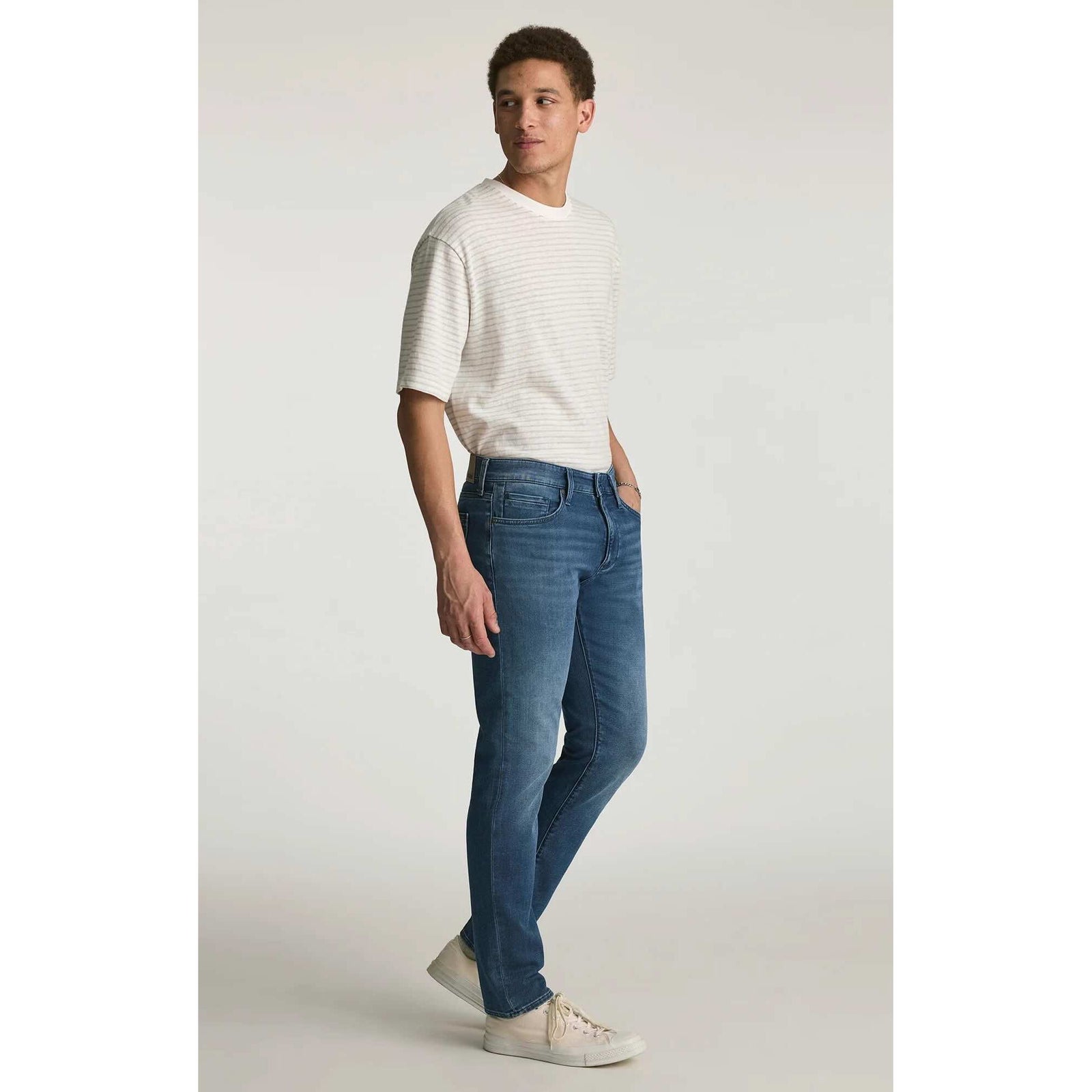 Mavi Jake Mid Explorer Denim in medium blue, regular rise, slim through hip and thigh on model.