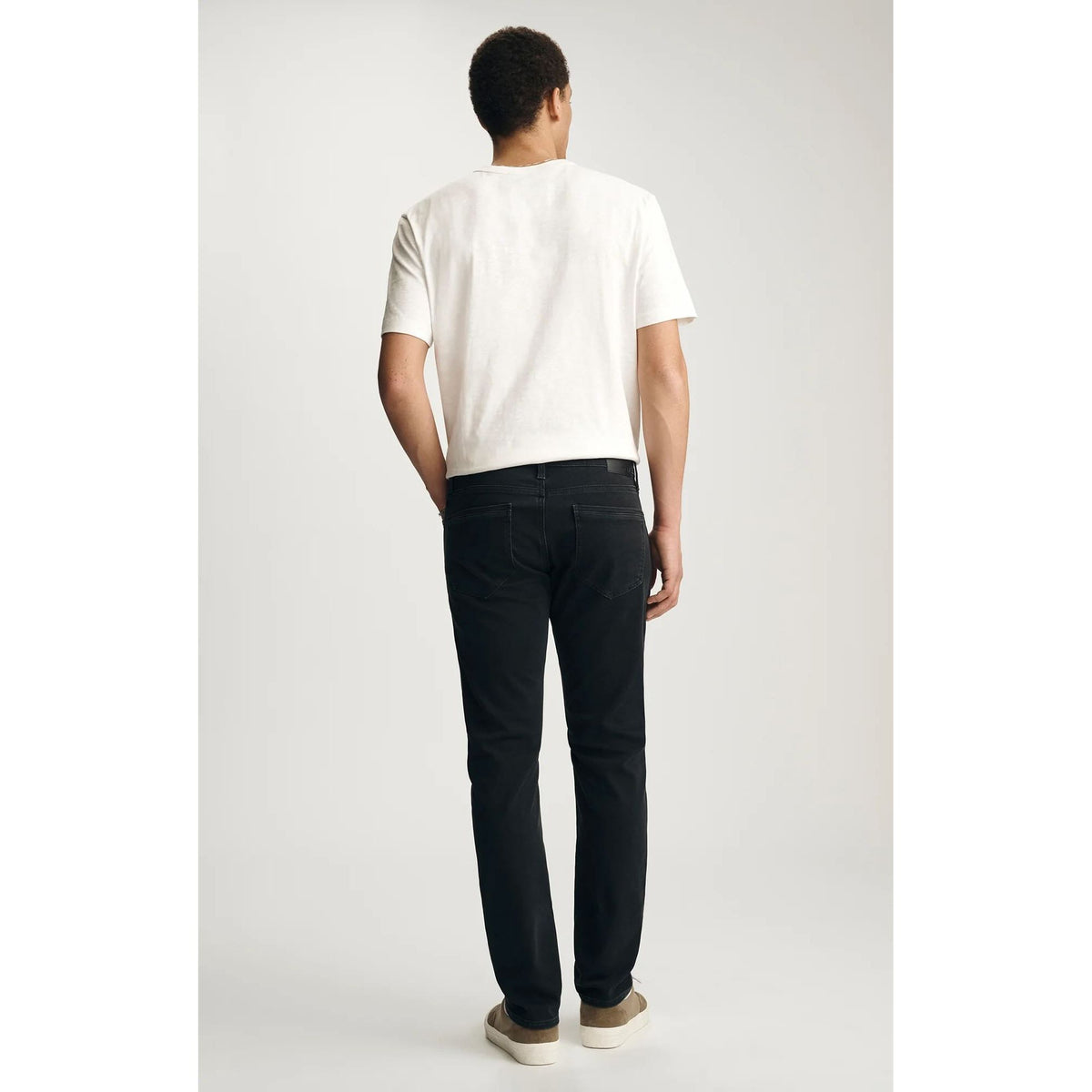 Mavi Jake Smoke Explorer Denim in washed-out black, regular rise, slim through hip and thigh, back view
