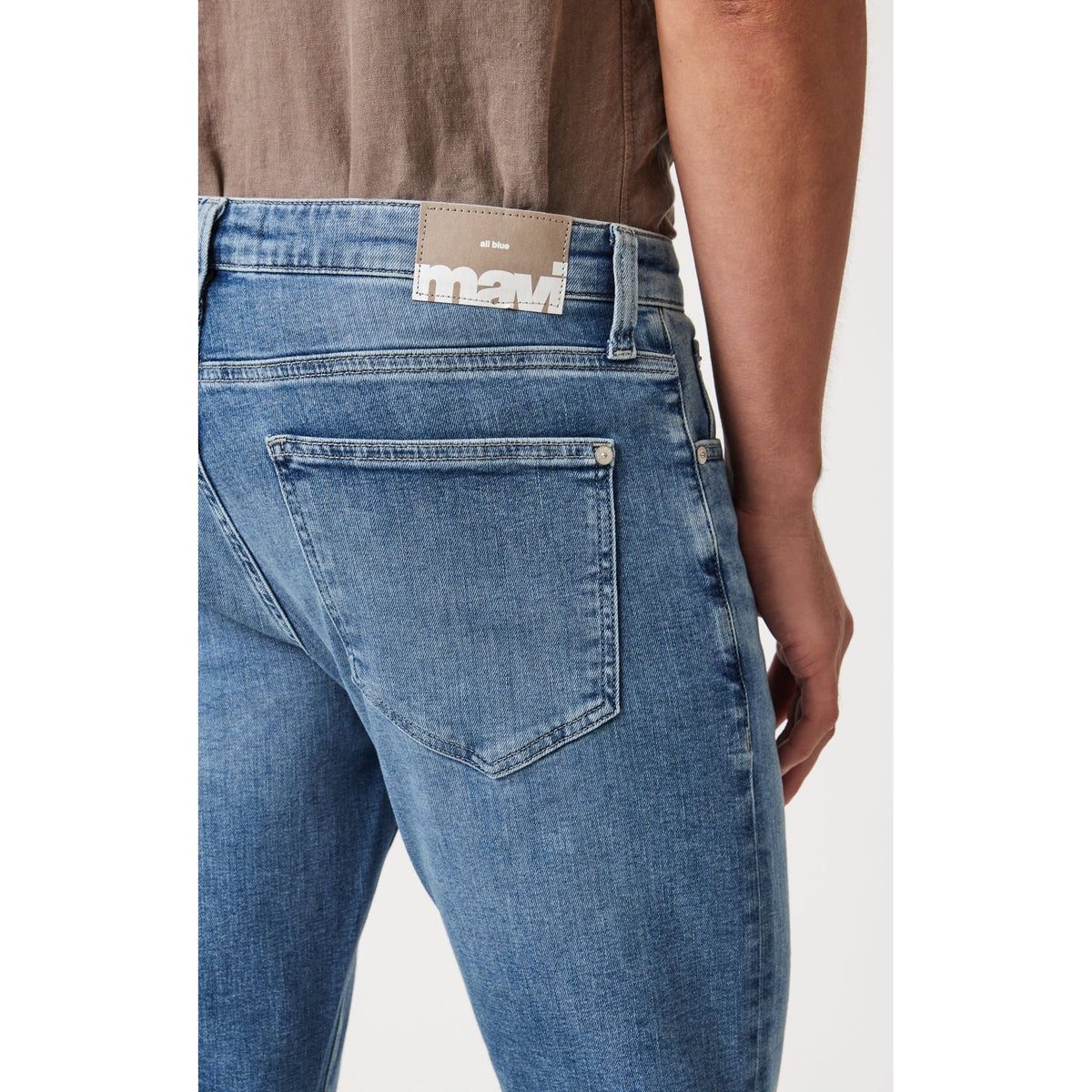 Mavi Josh Mid Brushed Classic Blue Bootcut jeans showcase a stylish back pocket design and a perfect fit for comfort.