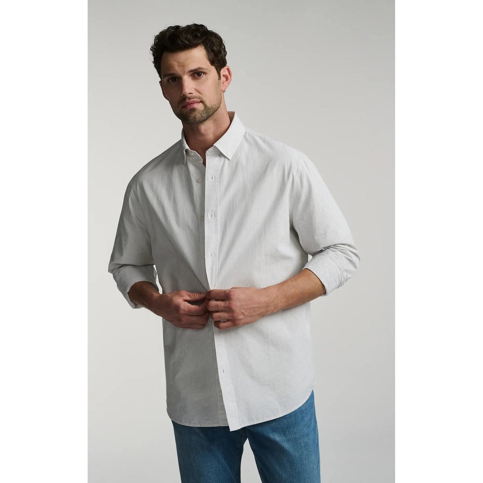 Explore the Mavi Long Sleeve Button Up Shirt, a stylish cotton shirt with subtle stripes for versatile layering.
