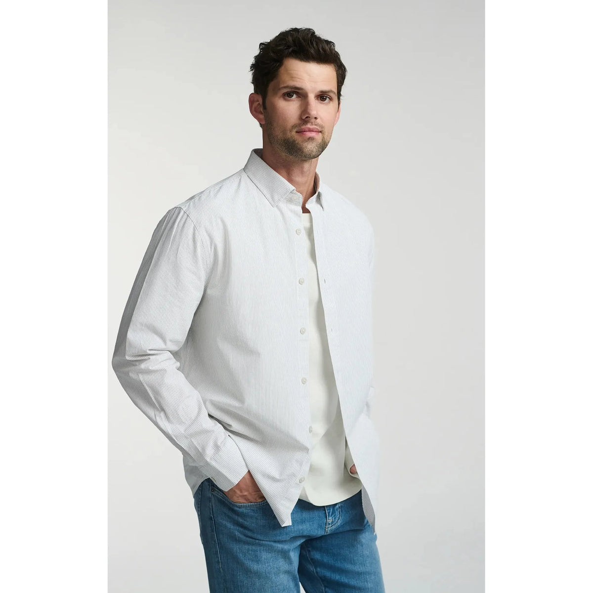 Elevate your style with the Mavi Long Sleeve Button Up Shirt, featuring subtle stripes for a polished look.