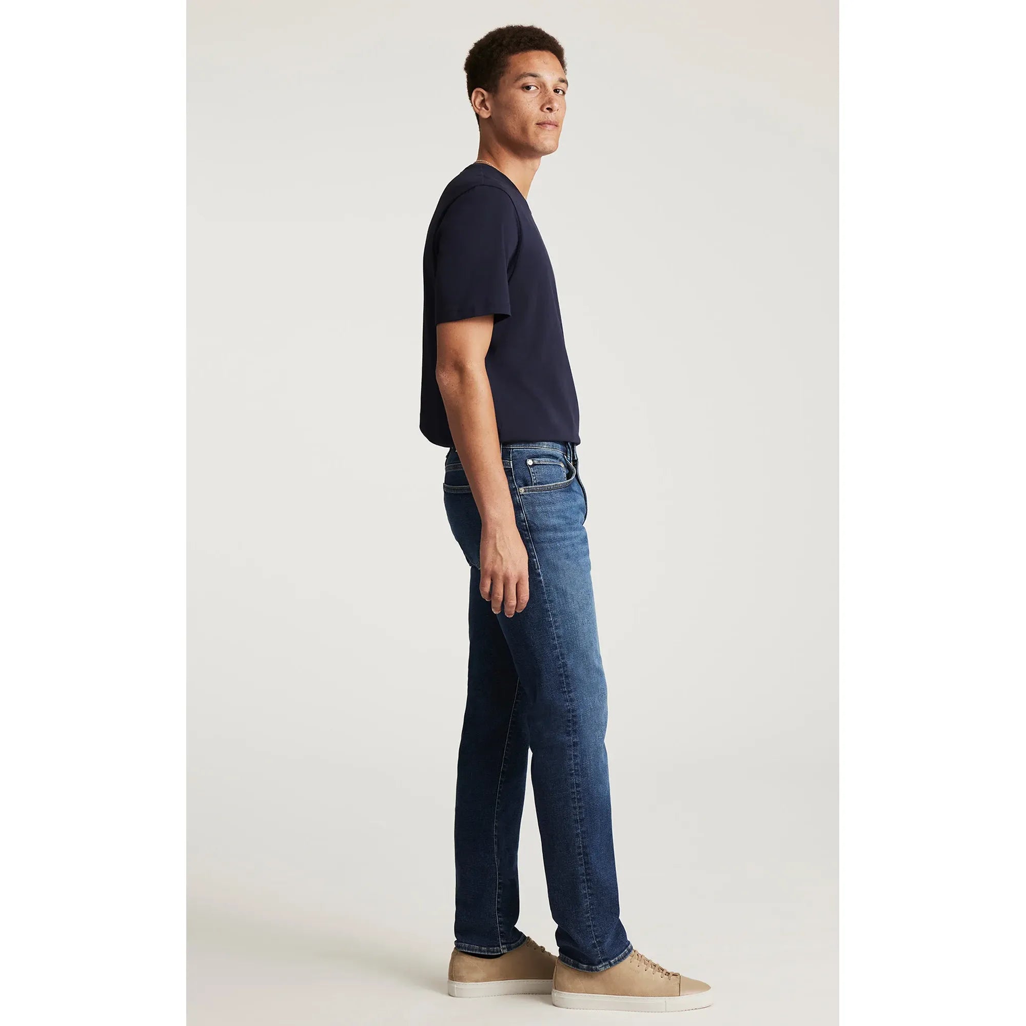Mavi Zach Deep Brushed Classic Vintage Denim jeans with regular rise and straight leg, worn by a man in navy tee.