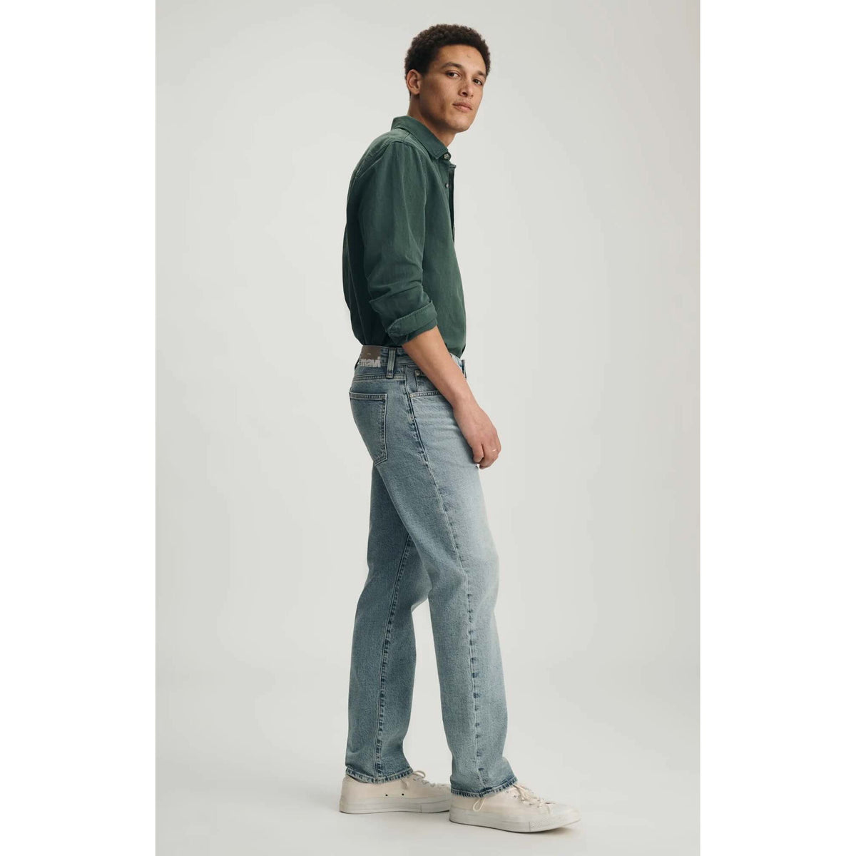 Male model wearing Mavi Zach Lt Shaded Classic Blue Denim jeans, straight-leg, light-wash.
