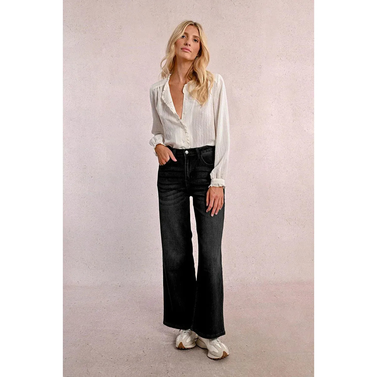 Model wearing Molly Bracken Jamie Wide Leg Black Denim Pants with a white blouse.