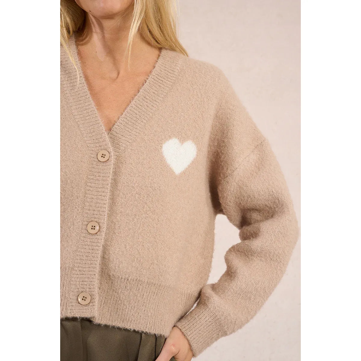 Beige Molly Bracken Short Heart Cardigan with white heart motif, V-neck, long sleeves, horn button fastening.