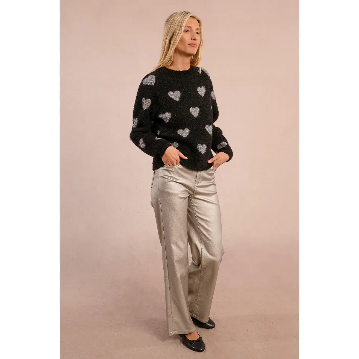 Molly Bracken Heart Sweater on a model: black fuzzy knit with grey heart pattern, round neck, long sleeves.