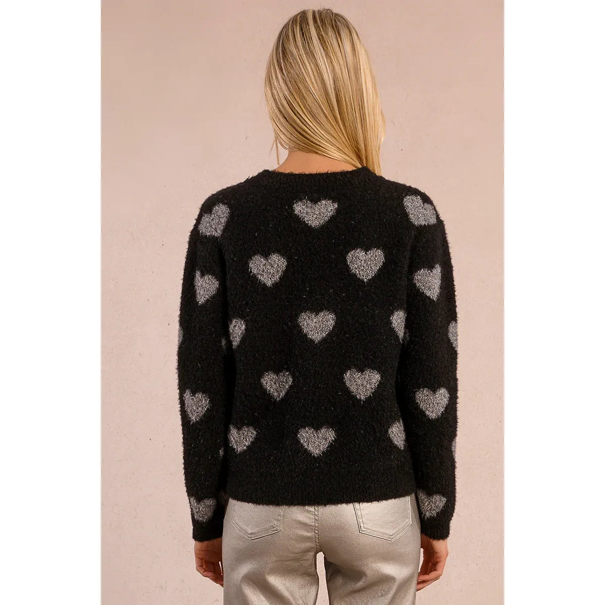 Molly Bracken Heart Sweater: black fuzzy knit with grey heart motifs, back view, long sleeves, round neckline.