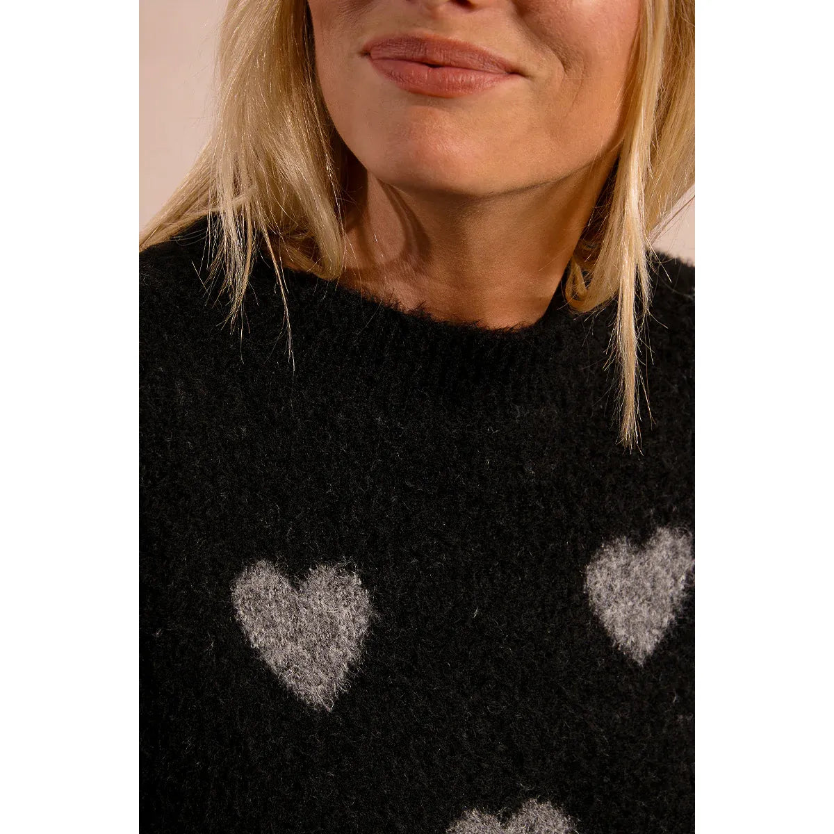 Molly Bracken Heart Sweater in black heather knit with gray heart motifs.