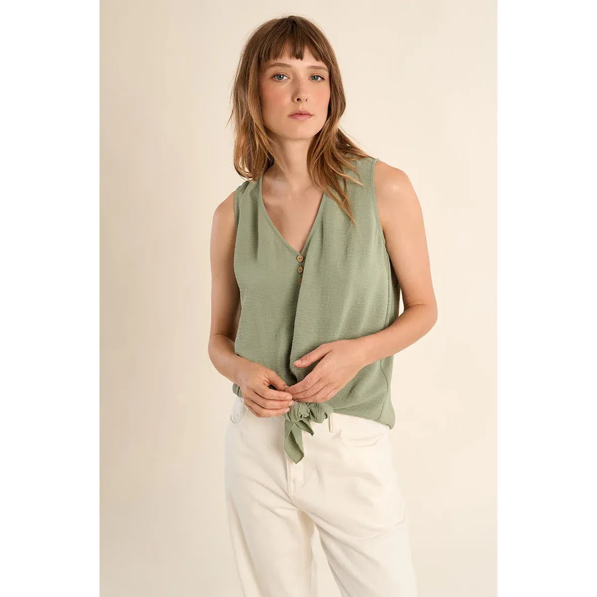 Molly Bracken Knotted Tank Top in sage green with V-neck, wooden buttons, and knotted waist on model.
