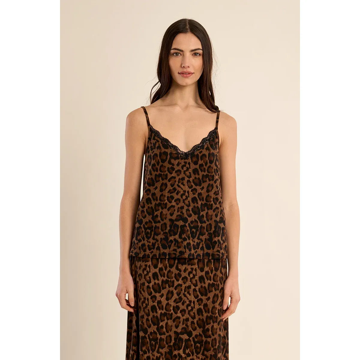 Leopard print camisole with black lace trim neckline and thin straps, paired with matching skirt.