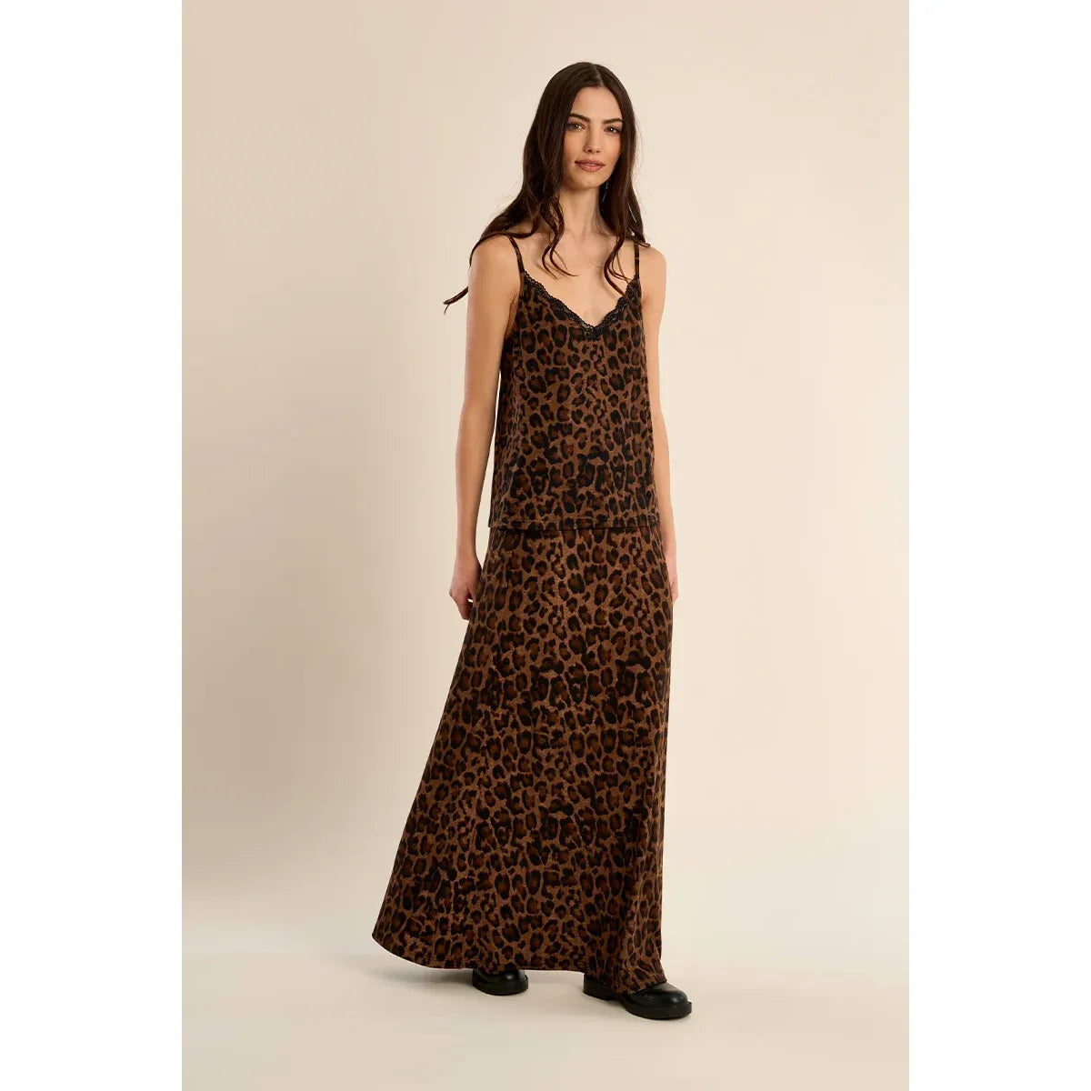 Leopard print camisole with black lace trim and thin straps paired with matching long skirt.