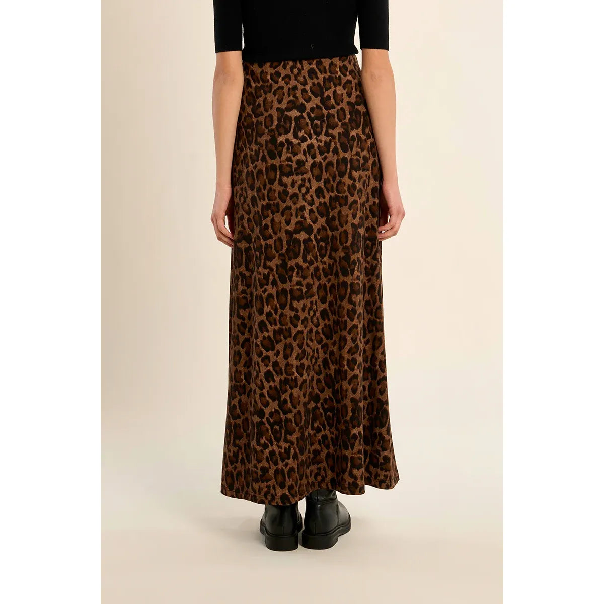 High-waisted leopard print maxi skirt with elastic waistband. Straight fit leopard skirt pairs with boots for fall or a tee for everyday wear.