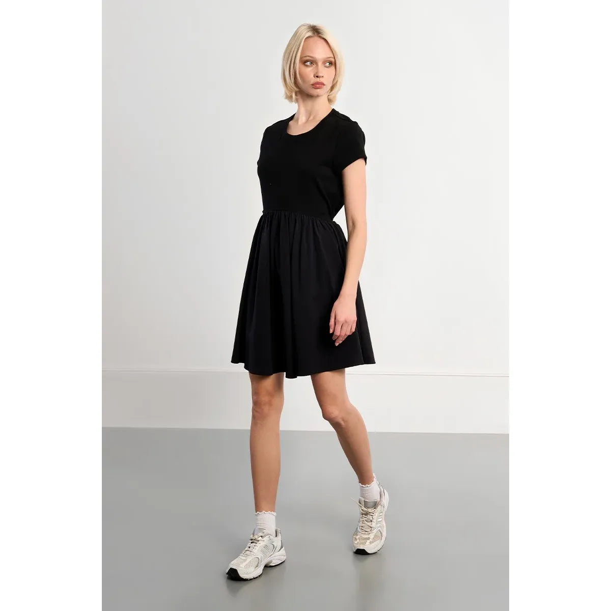 Molly Bracken black nylon jersey-blend adjustable drawstring-waist mini dress with boat neck and short sleeves.