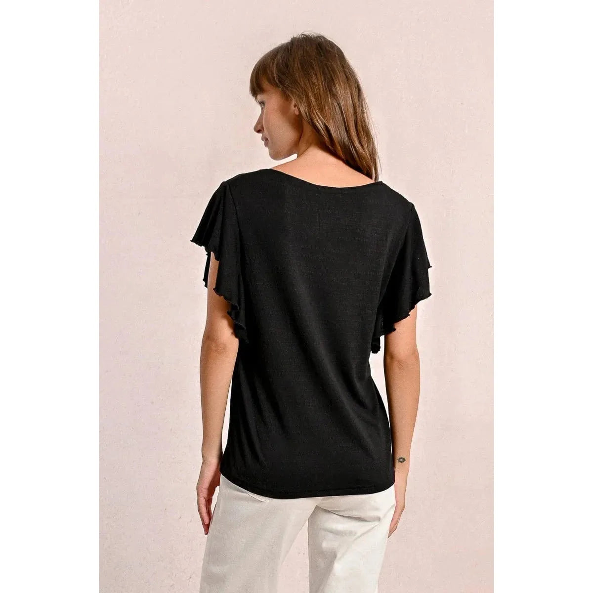 Stylish back view of the Molly Bracken Ruffled Tshirt, featuring ruffled sleeves and a fluid design. Perfect for any wardrobe!