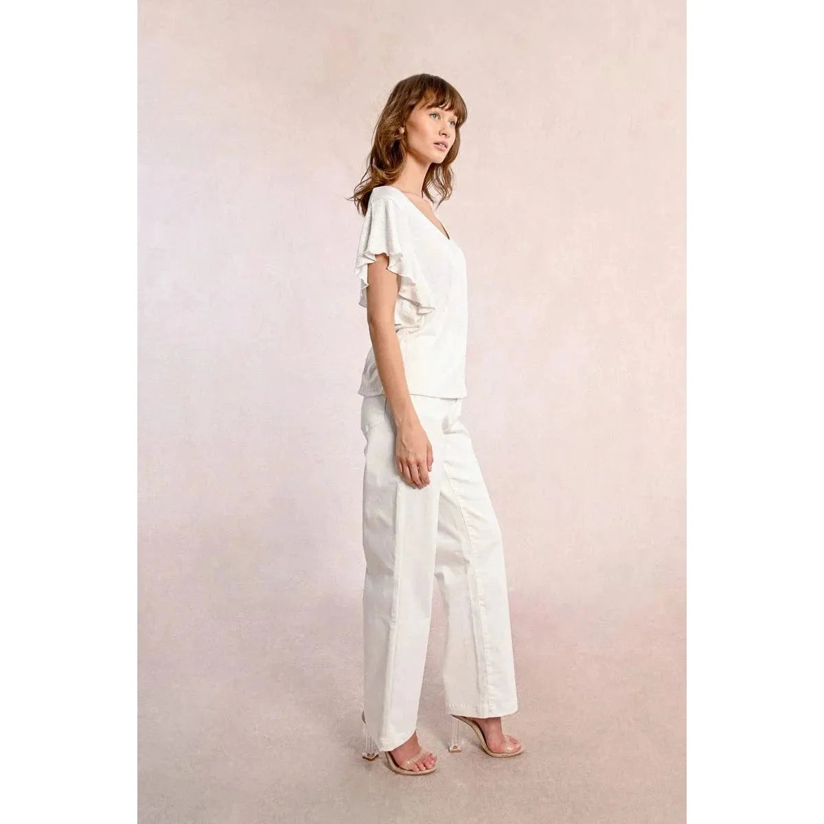 Molly Bracken Ruffled Tshirt in off-white features a V neckline and playful ruffled sleeves for a chic look.