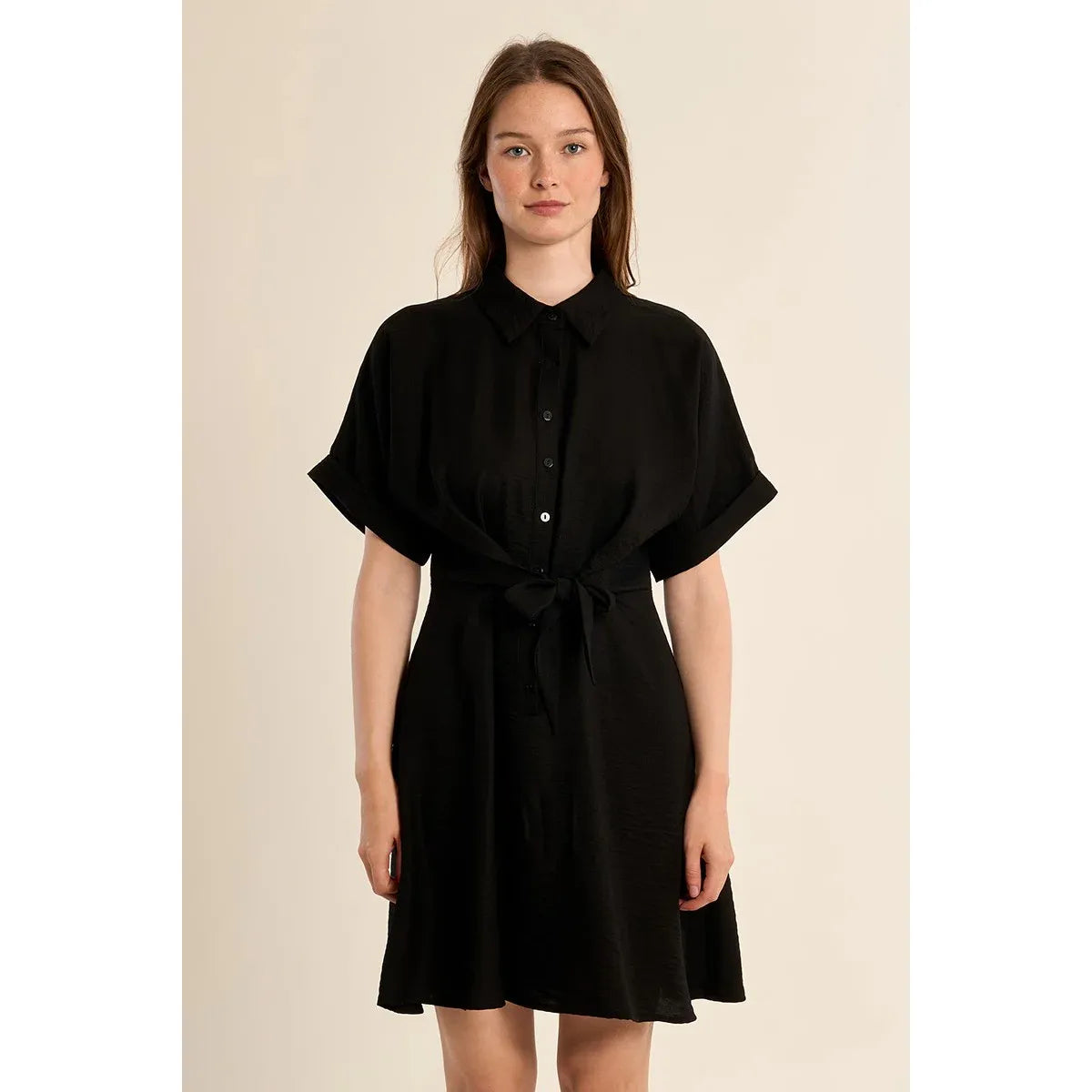 Molly Bracken Short Dress in black with knotted waist, short sleeves, and a shirt collar on a model.